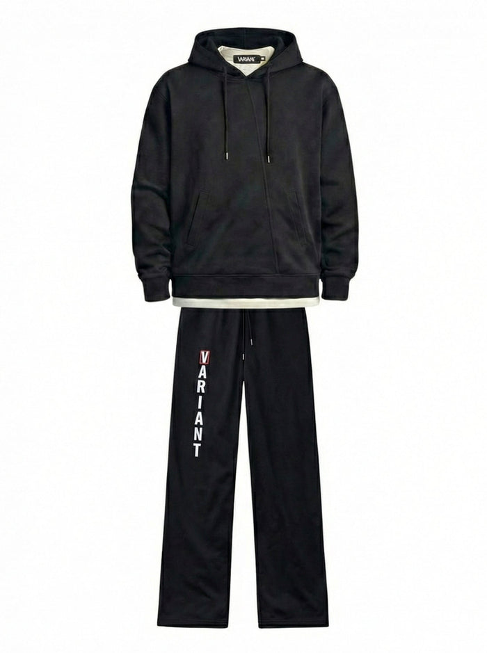Black tracksuit with 'Variant' branding on pants against a white background